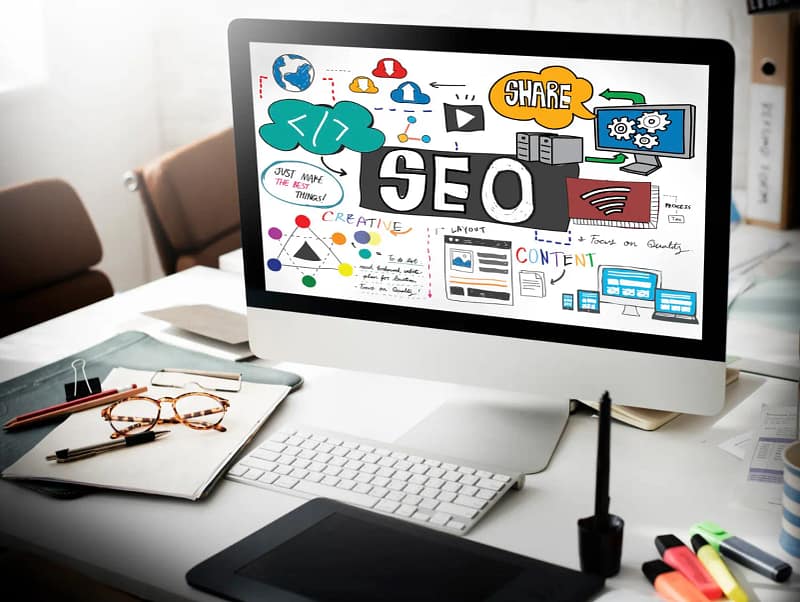 Écran d’ordinateur affichant une illustration sur le SEO, le contenu et le partage pour illustrer le SEO local WordPress à Lyon.